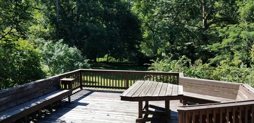 Nestled near woods and creek, this large home is near state parks and colleges..