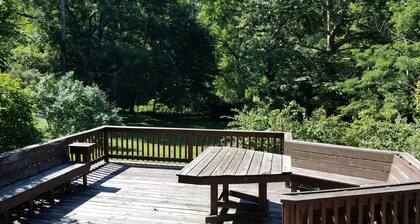 Nestled near woods and creek, this large home is near state parks and colleges..