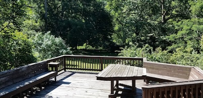 Nestled near woods and creek, this large home is near state parks and colleges..