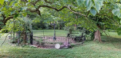Nestled near woods and creek, this large home is near state parks and colleges..