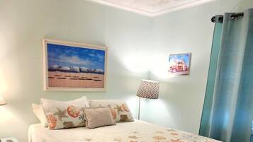 1 bedroom, desk, iron/ironing board, travel crib