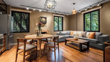 Deluxe Apartment | Living area | 50-inch Smart TV with cable channels, TV