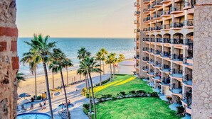 A hotel with multiple balconies overlooking a beach and a pool area. - Oceanfront View- Sandy Beach-Sonoran Sea Resort (Puerto Peñasco)