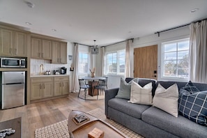 Enjoy a comfortable living space with a kitchen, dining area, and cozy seating area.