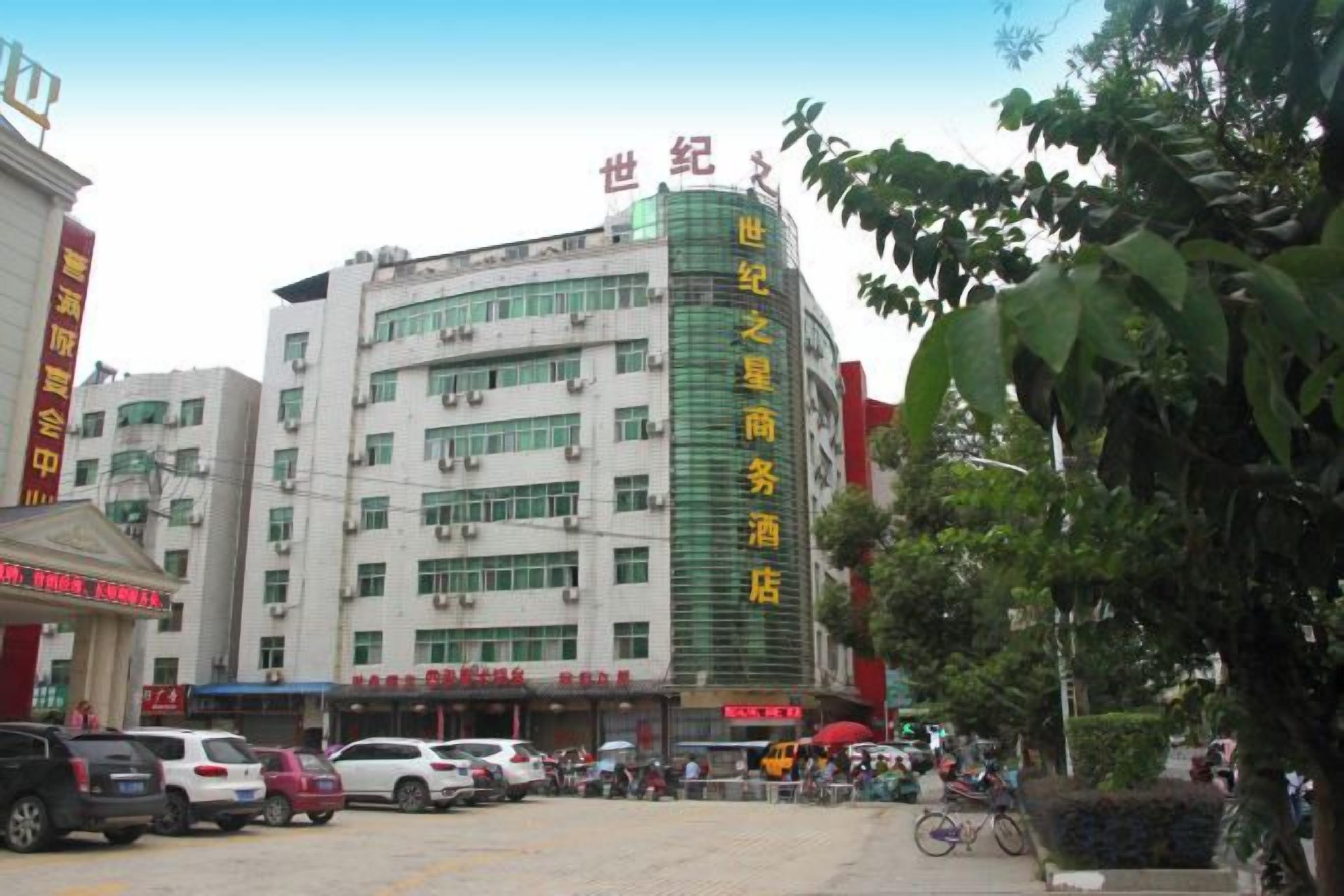 A multi-story building with signage indicating it is a hotel.