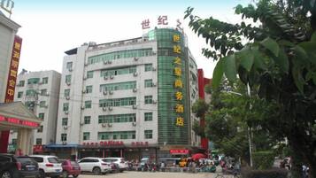 A multi-story building with signage indicating it is a hotel.