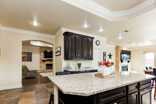 The ultimate resort ranch style pool home on nearly a half acre!