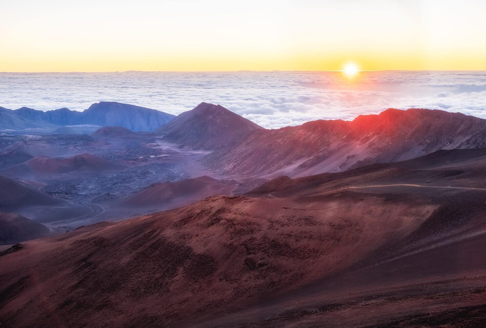 A mountainous landscape with a road winding through it.