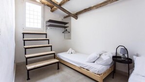 A small, single-bed room with a wooden ladder, a window, and a nightstand with a lamp. - Rustic Sicilian hamlet area Partinico / Alcamo/ Balestrate (Partinico)
