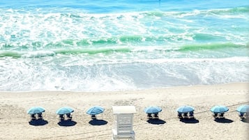 On the beach, sun-loungers, beach towels