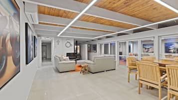 Villa | Living area | 52-inch TV with cable channels, fireplace