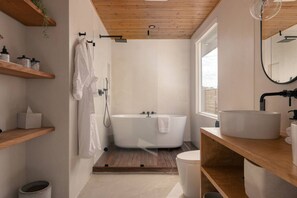 Bathtub, eco-friendly toiletries, hair dryer, towels
