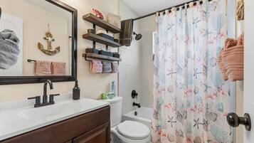 Combined shower/tub, hair dryer, towels, soap