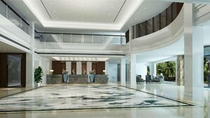 A spacious lobby with a marble floor, a reception desk, and a seating area with chairs and a sofa. - Dong'an Ziyuan Hotel (Zishui National Wetland Park High-Speed Railway Station Branch) (Dong'an)