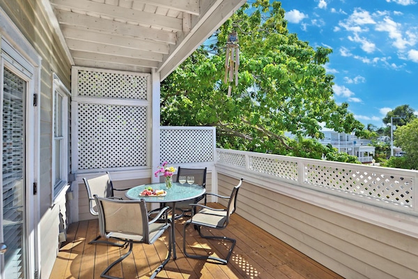 Enjoy alfresco meals on the sunny porch.