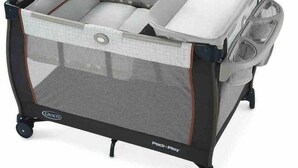 A Graco room-in-a-box playpen with a mesh front, cushioned interior, and wheels. - Relaxing Hot Tub Home, 2 King Beds, Dog-Friendly, Golf Course (Cape Coral)