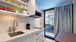Fridge, microwave, stovetop, coffee/tea maker