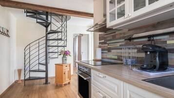 Fridge, stovetop, coffee/tea maker, cookware/dishes/utensils