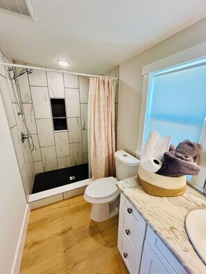 Bathtub, hair dryer, towels, soap