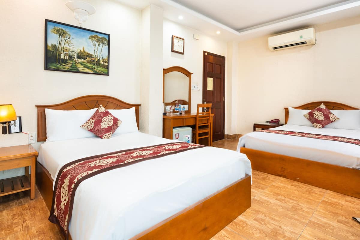 superior quadruple room, 2 queen beds, balcony, city view | hypo-allergenic bedding, minibar, desk, laptop workspace