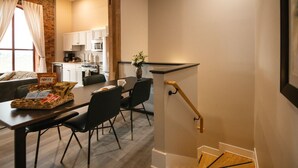 A modern kitchen with white cabinets, a microwave, and a coffee machine. - 2 Bedroom Townhouse Downtown Elkin Yadkin Valley (Elkin)