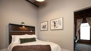 1 bedroom, premium bedding, iron/ironing board, travel crib