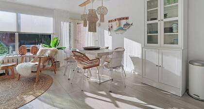 Stylish vacation home with bright furnishings and garden and terrace and porch.