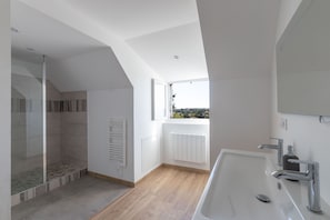 Combined shower/tub, hair dryer, towels, toilet paper