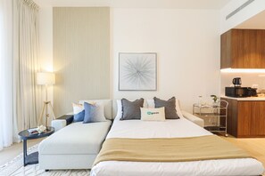 Luxury Apartment | Living area | 55-inch Smart TV with cable channels, TV, Netflix - HiGuests - La Cote B2 (Dubai)