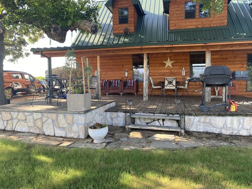 Beautiful log cabin with huge wrap around porches!