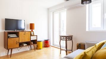 City Apartment | Living area | 32-inch Smart TV with cable channels, TV, streaming services