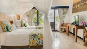 A bedroom with two beds, a desk, and a chair. - Sunset Villa by Premier Hospitality Asia (Nusa Dua)
