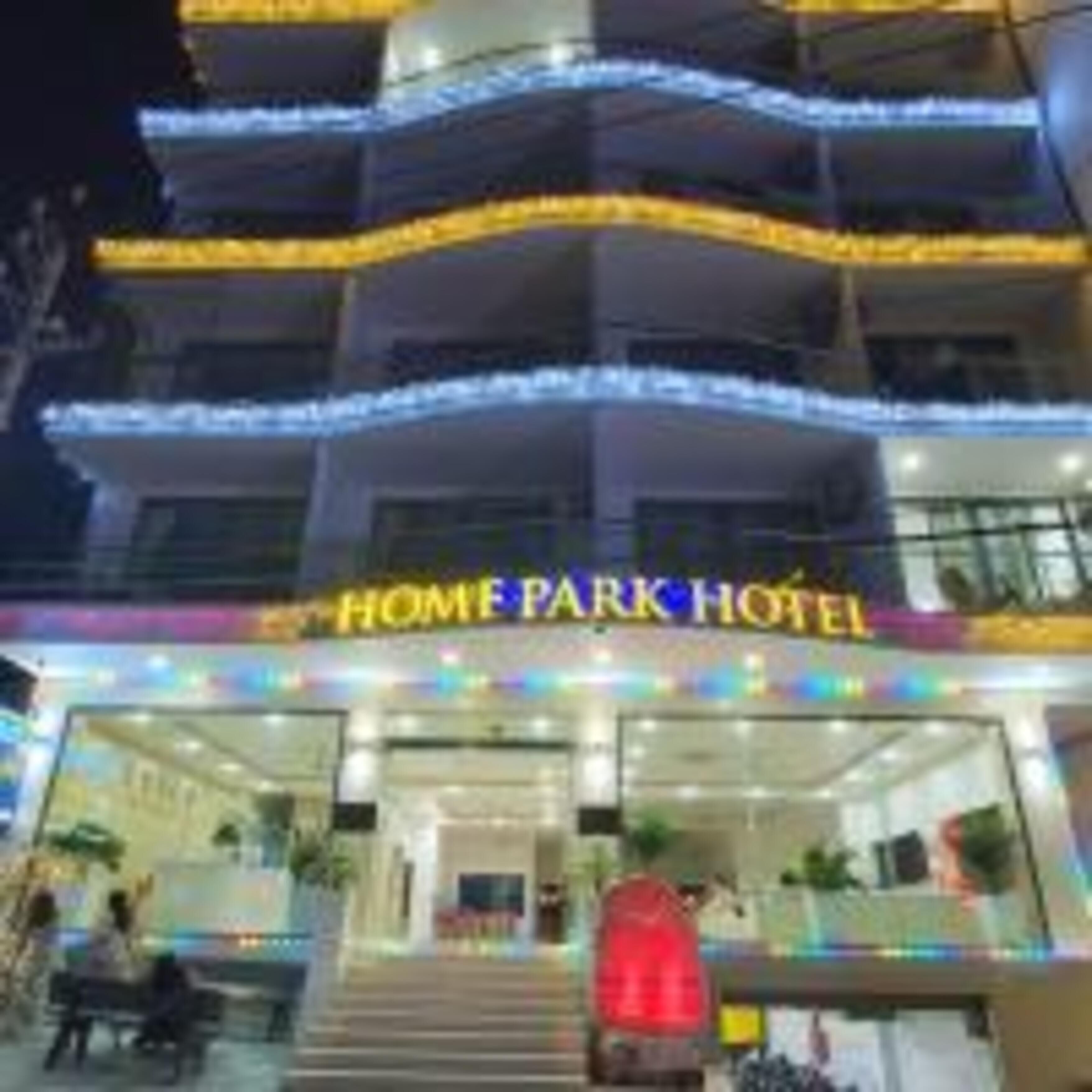 A multi-story building with the sign "HOME PARK HOTEL" at the entrance.