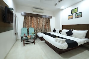 Premium bedding, down comforters, pillowtop beds, rollaway beds - Saish Hotel (Rahata)