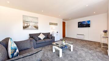 Deluxe Apartment | Living area | 50-inch Smart TV with digital channels, TV