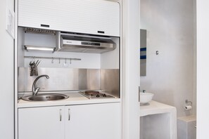 Fridge, stovetop, coffee/tea maker, cookware/dishes/utensils