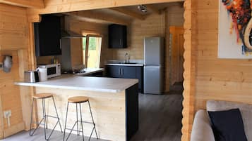 Cabin | Private kitchen | Fridge, microwave, oven, stovetop