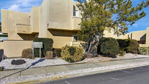 A modern building with a sign reading "Ocean Court Condominiums." - Beach Block Retreat w/Patio, Off Street Parking, Linens & Towels, Beach Gear (Seaside Heights)