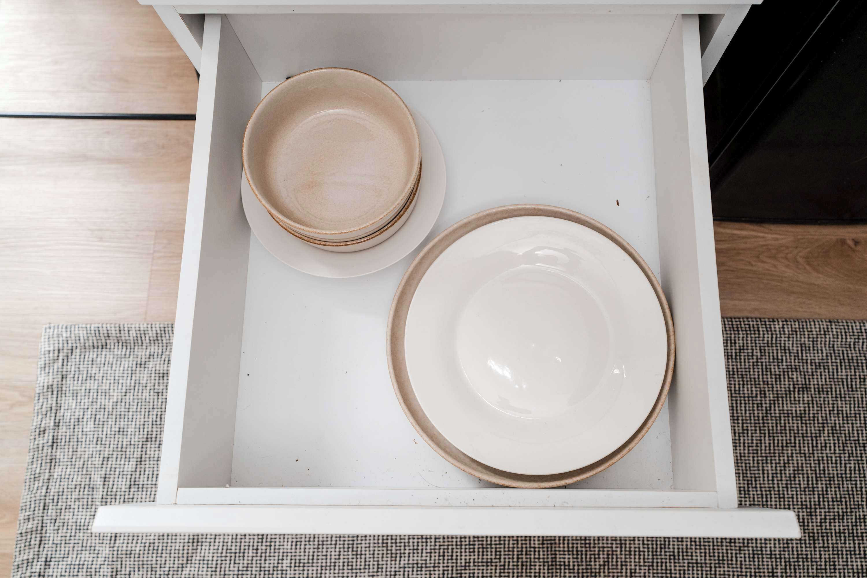 A drawer with two plates.