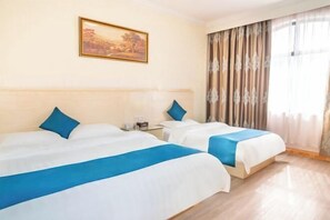 A hotel room with two beds, a painting on the wall, and a window with curtains. - Hezhou Xintai Hotel (Hezhou)