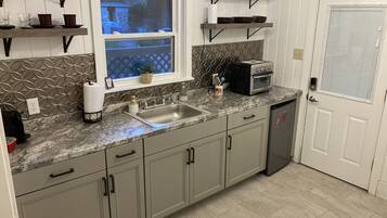 Fridge, microwave, coffee/tea maker, toaster