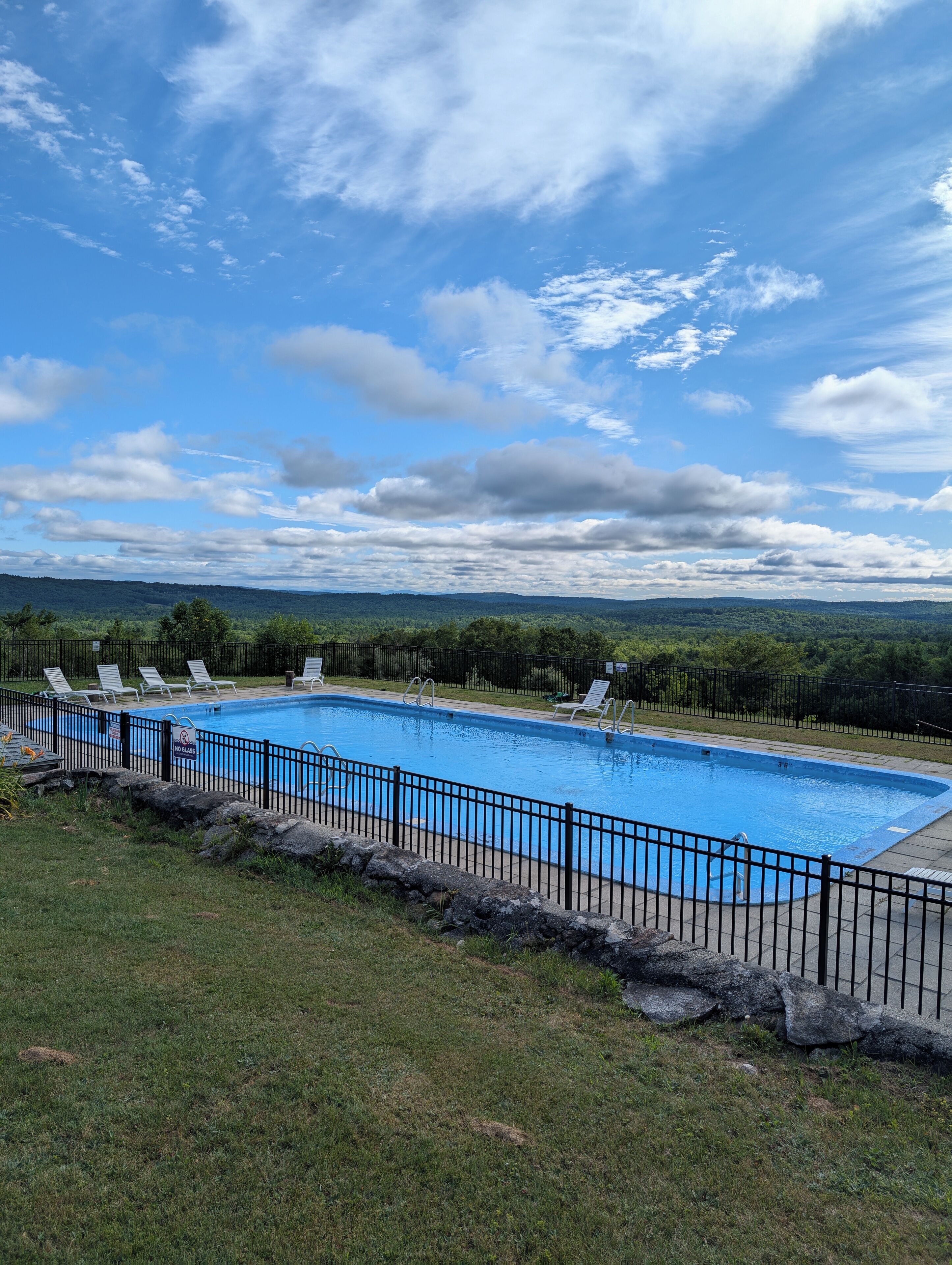 Seasonal outdoor pool, open 8:00 AM to 8:00 PM, pool umbrellas