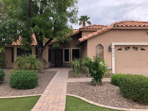 Enter an oasis with a well-maintained entrance and beautifully landscaped surroundings.