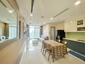 Living area | Flat-screen TV, offices - Vinhomes Luxury-Christine Apartment (Ho Chi Minh City)