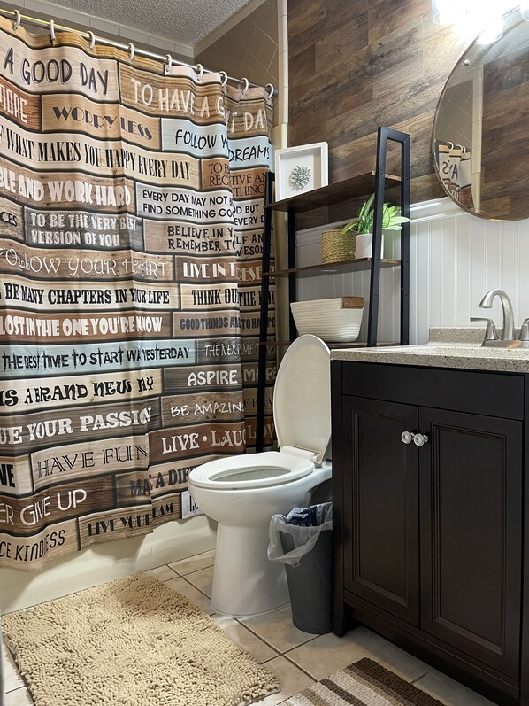 Combined shower/tub, hair dryer, towels, soap