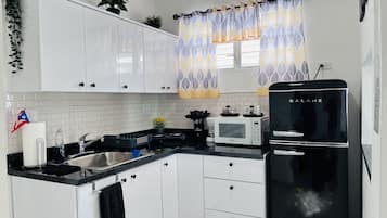 Fridge, microwave, stovetop, coffee/tea maker