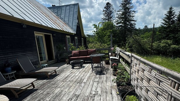 A wooden deck with outdoor furniture, a metal roofed building, and a wooden fence. - Journey/Retreat ready! Private swimming hole, just 2hrs from Boston (Corinth)