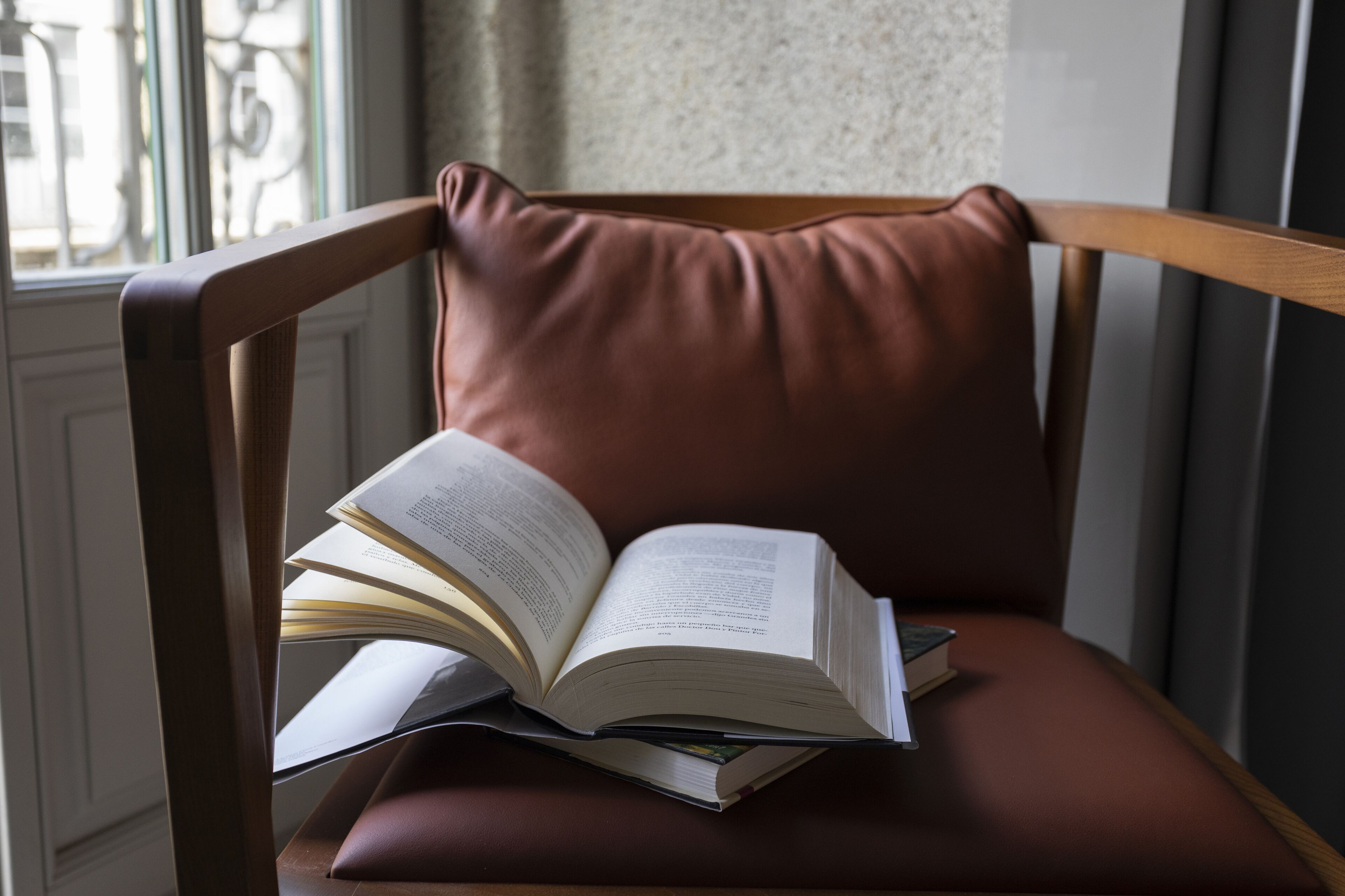 A chair with a book on it.