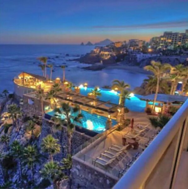 Relax by the infinity pool overlooking the ocean and enjoy breathtaking views of the coastline.