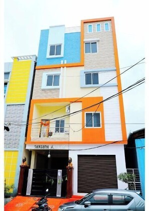Stylish residential building with a unique facade and entrance.